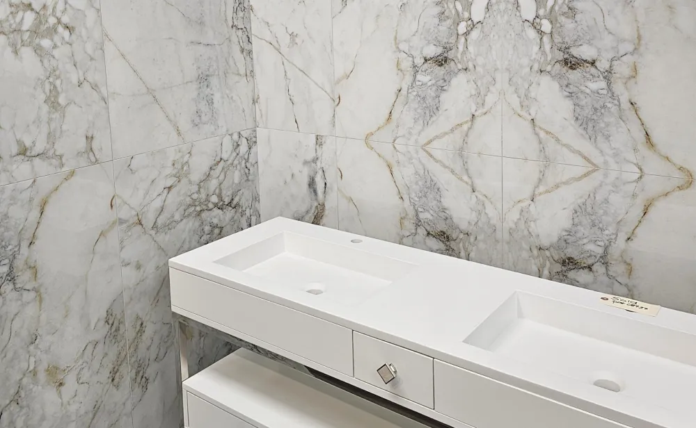White marble bathroom with double sink.