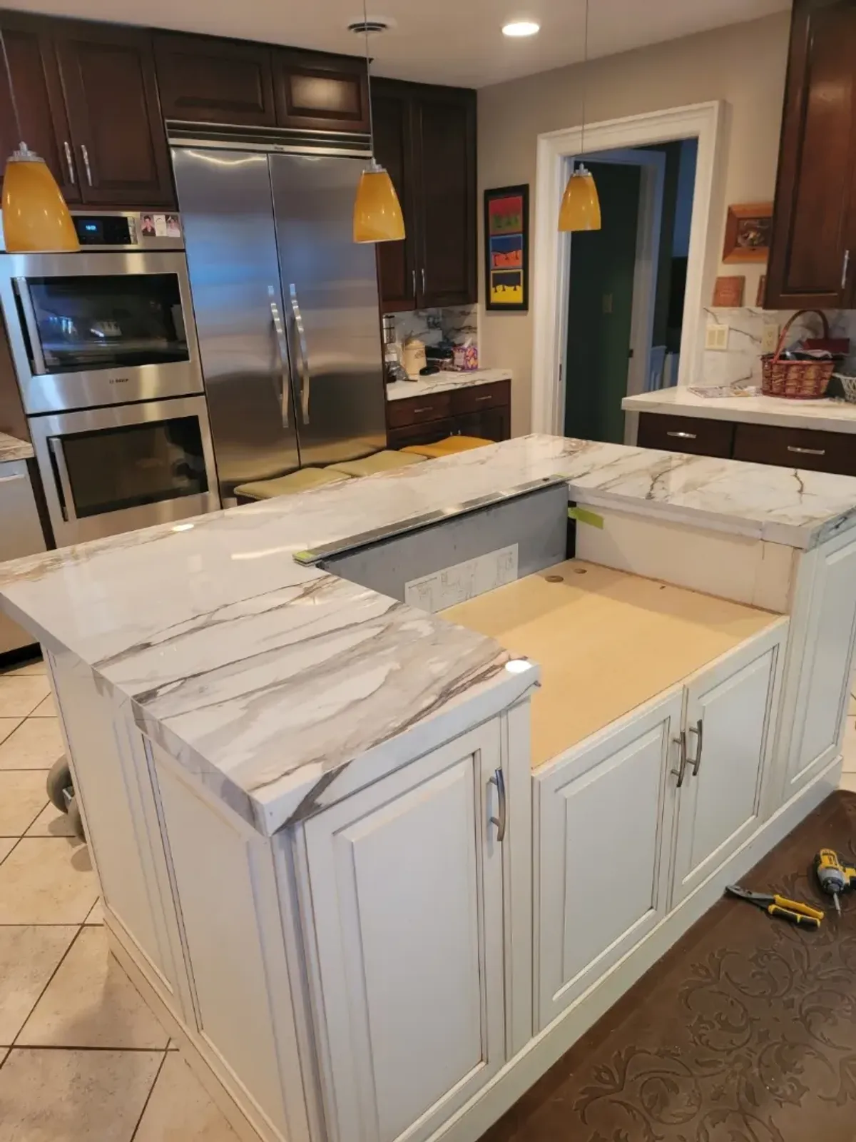 Modern kitchen with marble countertop installation.