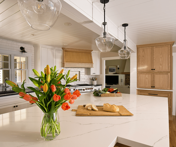 Modern kitchen with flowers and bread.